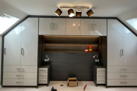 Fitted bedroom in high gloss Grey and Anthracite.